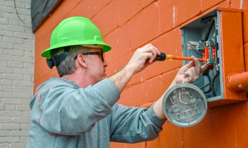 Utility worker Replacing Meter